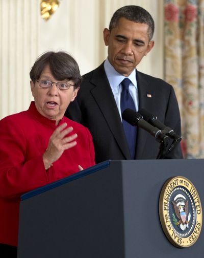 Mary Jo White and President Barack Obama are seen Thursday. (Associated Press)