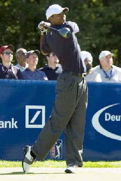 
Tiger Woods tees off from the 14th tee during the Pro-Am event at the Deutsche Bank Championship on Thursday. 
 (Associated Press / The Spokesman-Review)