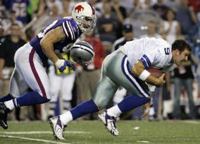 
Despite a poor performance Monday night,  Cowboys quarterback Tony Romo, right, managed to keep his head. Associated Press
 (Associated Press / The Spokesman-Review)