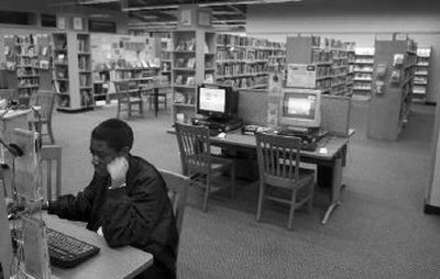 Demetrie Thompson does homework research on a computer at the Moran Prairie Library.
(CHRISTOPHER ANDERSON / The Spokesman-Review)