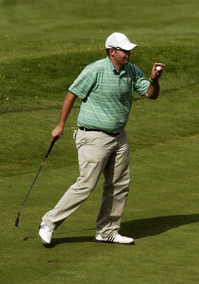 
Amateur Cody Upham acknowledges the crowd after sinking a birdie putt on No. 18 to win the Rosauers Open.
 (J. Bart Rayniak / The Spokesman-Review)