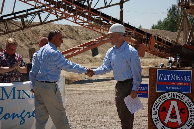 Idaho Congressman Walt Minnick, left, shakes hands with Burke Hansen, right, president of Idaho Associated General Contractors, after the group endorsed his re-election bid on Wednesday (Courtesy photo)