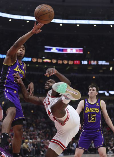 Lakers forward Rui Hachimura, left, and Bulls forward Patrick Williams battle for a rebounds on Wednesday at the United Center.  (Tribune News Service)