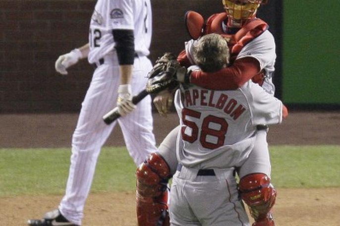 Boston Red Sox pitcher Jonathan Papelbon, left, and catcher Jason Varitek  celebrate after the Red Sox beat the Colorado Rockies, 4-3, to win the  baseball World Series Sunday, Oct. 28, 2007, at