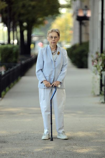 Financial planner Barbara Susin, 72, stands outside her home in Chicago in August.
