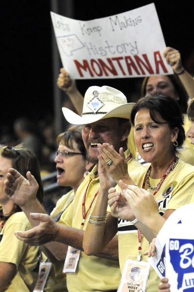 Bruce Beregson, left, and Terri Kurth cheer on the Billings team in their victory over California on Wednesday. (Associated Press)