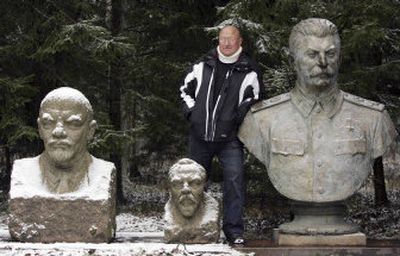 
Lithuanian millionaire Viliumas Malinauskas, the founder and owner of Yet Grutas Park, a quirky theme park dotted with relics of Lithuania's communist past, poses near his exhibits. Shown from left are busts of the Soviet founder Vladimir Lenin, Felix Dzerzhinsky, who was the founder of the first Soviet secret police force, and Josef Stalin. 
 (Associated Press / The Spokesman-Review)