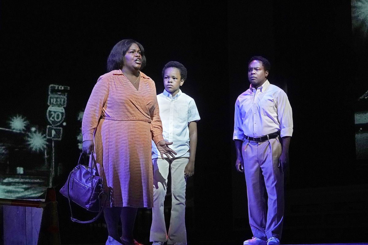 This Sept. 17, 2021 image released by the Metropolitan Opera shows, from left, Latonia Moore as Billie, Walter Russell III as Char’es-Baby and Will Liverman as Charles during a rehearsal for Terence Blanchard’s “Fire Shut Up in My Bones,” opening the Metropolitan Opera season on Sept. 27. (Ken Howard)