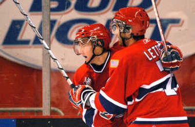 Ryan Letts, right, congratulates Mitch Wahl on his first-period goal Tuesday that gave the Spokane Chiefs a 2-0 lead.
(Brian Plonka / The Spokesman-Review)