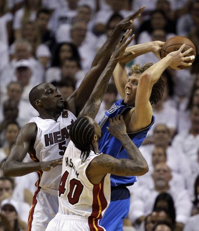 Udonis Haslem (40) hopes his Heat team can win NBA finals again, this time with college teammate Mike Miller. (Associated Press)