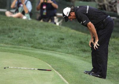 
Greg Owen of England reacts after missing a par putt on the 18th green on the final hole of the Bay Hill Invitational golf tournament in Orlando, Fla., on Sunday.
 (Associated Press / The Spokesman-Review)