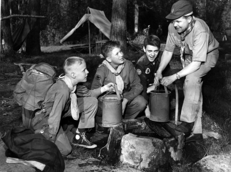 S-R Archive find of the day: In this 1952 photo, Dexter Rowell, John Forehand and David Raymond stop at a spring during a camporee with District Scout Executive Frank Fix . (The Spokesman-Review Photo Archi)