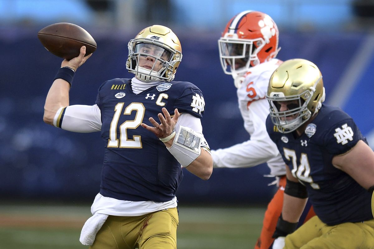 Notre Dame quarterback Ian Book throws a pass against Clemson during the Atlantic Coast Conference championship NCAA college football game, Saturday, Dec. 19, 2020, in Charlotte, N.C.  (Jeff Siner)