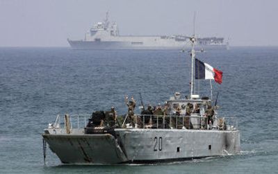 
A French landing vessel carrying U.N. peacekeepers from France and armored personnel carriers approaches the port of the southern border town of Naqoura, Lebanon, on Friday. 
 (Associated Press / The Spokesman-Review)
