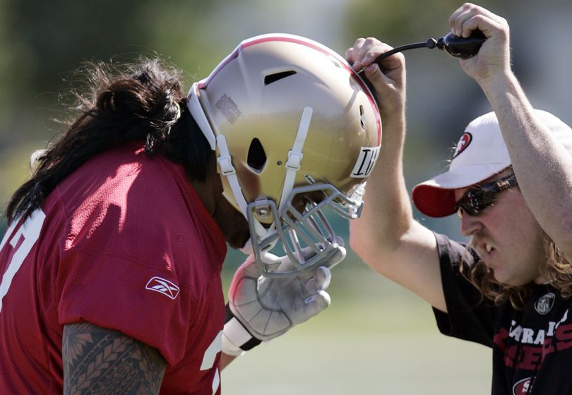 San Francisco 49ers guard Mike Iupati, a first-round draft pick from Idaho, is helped with his helmet during rookie football mini-camp at 49ers headquarters in Santa Clara, Calif., Friday, April 30, 2010. (Paul Sakuma / Associated Press)