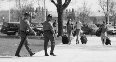 
 State police patrol the Virginia Tech campus in Blacksburg, Va.,  as  students arrive   Sunday. 
 (Associated Press / The Spokesman-Review)