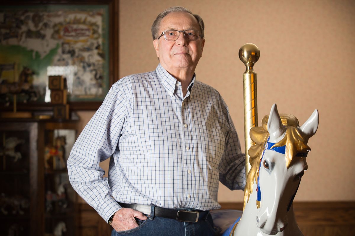 Richard Cox stands with his restored carousel horse, named Corona, at his home in Nine Mile Falls, Wash., on Jan. 19, 2021. Cox purchased the polycarbonate horse from the Tri-Cities at the beginning of the coronavirus pandemic and got to work sanding, picking out eyes and an authentic horsehair tail, and by September 2020, Corona was right at home amongst the many carousel horse figurines in the Cox