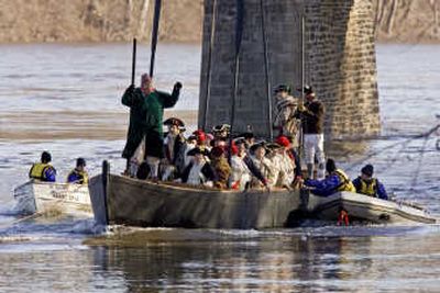 
Revolutionary War re-enactors are returned to the Pennsylvania shore by rescue craft Tuesday after attempting to cross the Delaware River  at Washington Crossing, Pa.Associated Press
 (Associated Press / The Spokesman-Review)