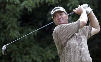 
Peter Jacobsen watches his tee shot on No. 18 en route to a 6-under-par 65 and a one-shot lead at the U.S. Senior Open.
 (Associated Press / The Spokesman-Review)