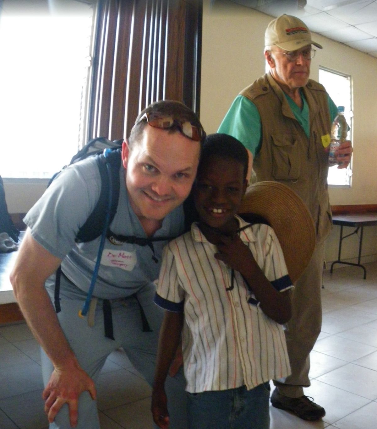 Rockwood Clinic and Sacred Heart surgeon Mathew Rawlins poses with a Haitian boy at a clinic in Port-au-Prince, the capital of the Caribbean nation devastated by an earthquake Jan. 12, 2010. Rawlins went on a weeklong humanitarian mission with the Church of Jesus Christ of Latter-day Saints to help the earthquake victims, performing surgeries surgeries and helping patients find proper care. (Courtesy of Mathew Rawlins)