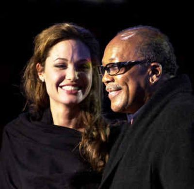 Actress Angelina Jolie and music producer Quincy Jones smile during the
