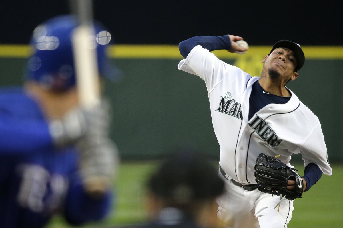 Seattle Mariners ace Felix Hernandez limited the Texas Rangers to two hits over seven innings on Saturday at Safeco Field. (Associated Press)