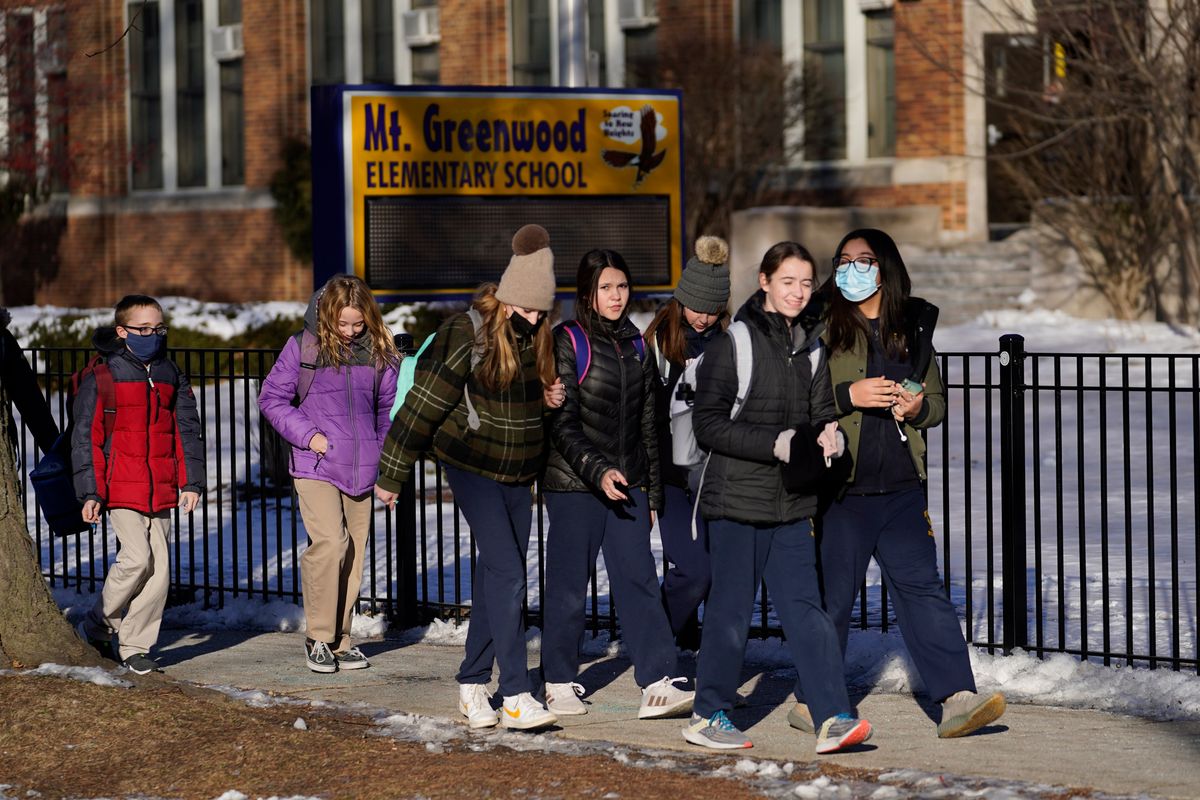 Students at the Mt. Greenwood Elementary School in Chicago depart after a full day of classes Monday, Jan. 10, 2022. As hundreds of thousands of Chicago students remained out of school for a fourth day students at the South Side school were back in classes as the school had enough staff to defy the union