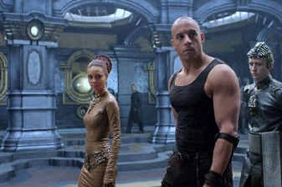 
Left to right, Dame Vaako (Thandie Newton), Riddick (Vin Diesel) and The Purifier ( Linus Roache), aboard the Necromonger command ship in the science fiction action-adventure, 