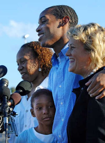 
Genarlow Wilson stands with family members outside prison Friday after the Georgia Supreme Court ruled his sentence was cruel and unusual.Associated Press
 (Associated Press / The Spokesman-Review)