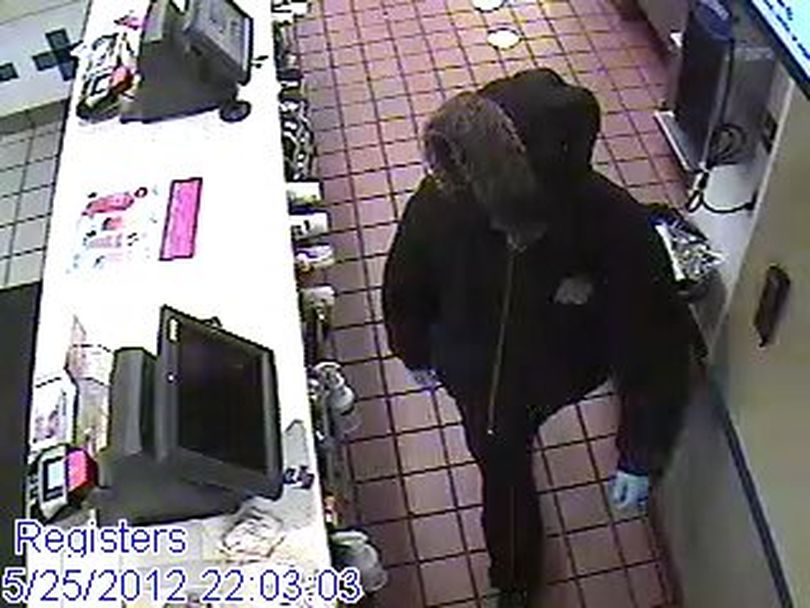Four masked robbers took over a McDonald's on the South Hill Friday night, and police are asking for help identifying them.
Police today released surveillance photos of the robbers, who accosted six people inside the restaurant at 4647 S. Regal St., just after 10 p.m.
The victims complied with demands and none was injured. The robbers, who wore black clothing, fled on foot before police arrived.
 (Spokane Police Department)