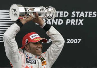 
Lewis Hamilton celebrates after winning the United States Grand Prix at Indianapolis Motor Speedway.Associated Press
 (Associated Press / The Spokesman-Review)