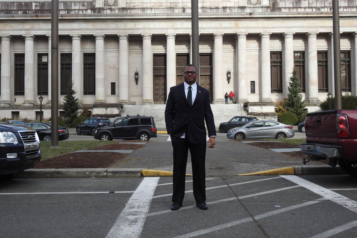 Former Washington State football player Jeremiah Allison, who plans on attending law school in the near future, poses in front of the Washington state Supreme Court building. (Jacob Thorpe / The Spokesman-Review)