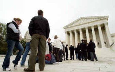 
People line up outside the U.S. Supreme Court on Wednesday in Washington. The court grappled over the morality and propriety of putting to death people who killed when they were juveniles, an almost uniquely American punishment.
 (Associated Press / The Spokesman-Review)
