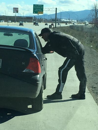 WSP Trooper Jeff Sevigney gives a driver a warning for driving several miles in the left lane on I-90 on March 17, 2016. (Nina Culver)