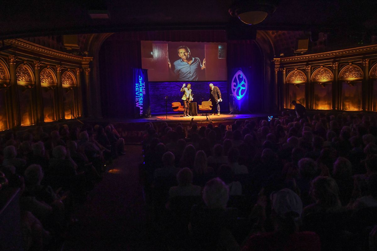 Local writer Jess Walter waves to the crowd during talk about his new book “The Angel of Rome and Other Stories” during a Northwest Passages event held at Bing Crosby Theater in Spokane on Tuesday, June 28, 2022.  (Kathy Plonka)