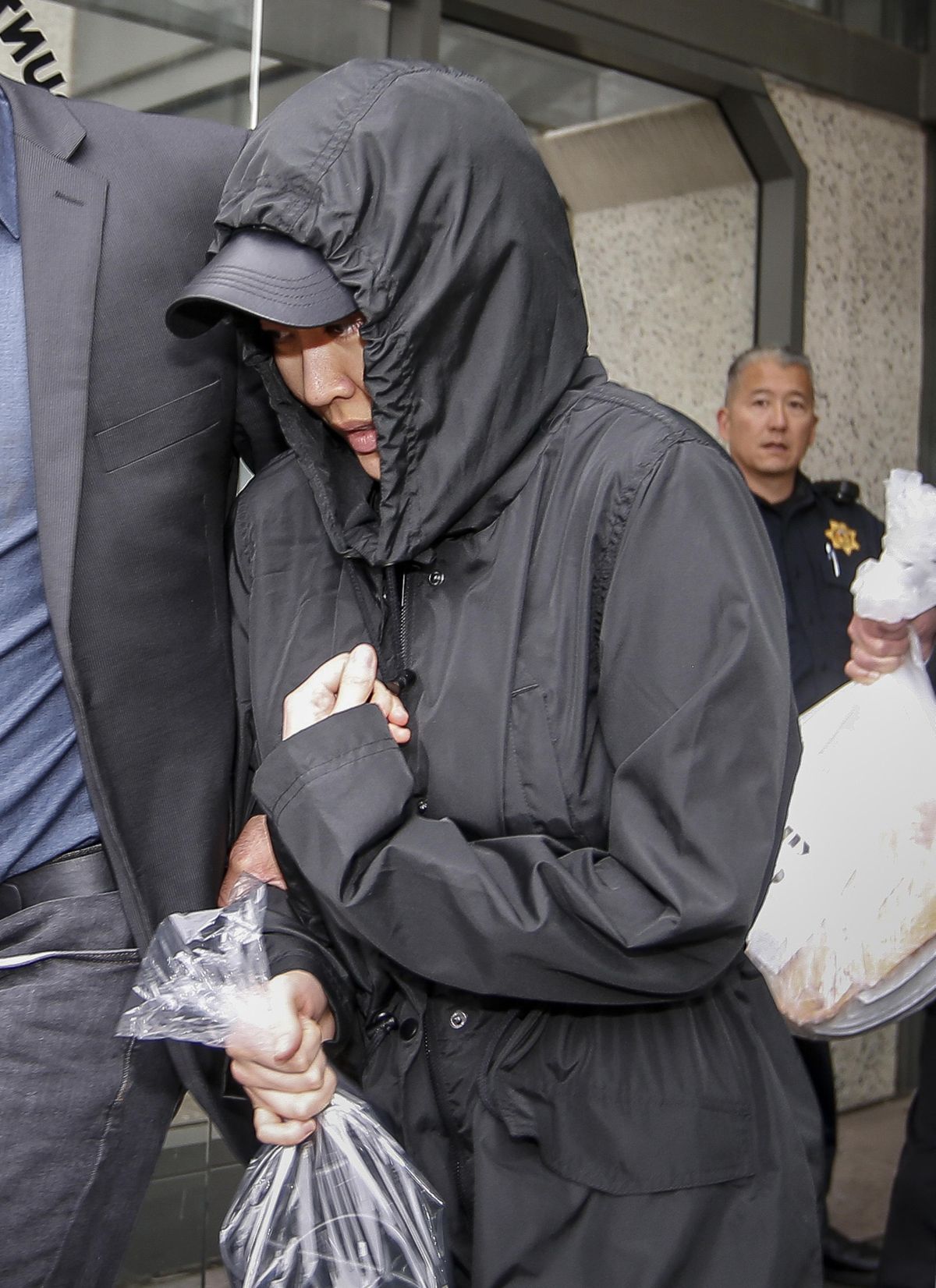 In this April 6, 2017 photo, Tiffany Li, a Northern California woman accused of killing the father of her two children, leaves San Mateo County Jail after posting $35 million bail in Redwood City, Calif. Keith Green was a popular but troubled high school football star who had recently washed out of college when he met Tiffany Li. She was the pretty, jet-setting daughter of a rich and powerful Chinese family who was born in Beijing and grew up in the Silicon Valley. She changed his life. Now Li, her new boyfriend and her bodyguard face first-degree murder charges in Greens death. (Tony Avelar / Associated Press)