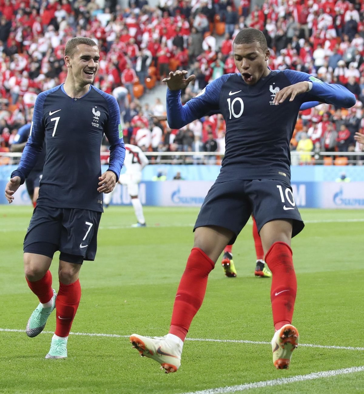 France’s Kylian Mbappe, left celebrates with teammate France’s Antoine Griezmann after scoring the opening goal of the game during the Group C match between France and Peru at the 2018 soccer World Cup in the Yekaterinburg Arena in Yekaterinburg, Russia, Thursday, June 21, 2018. (David Vincent / Associated Press)