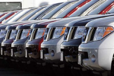 
Nissan sales also suffered in November. A long line of unsold 2007 Pathfinder sports utility vehciles sits on the back lot of a Nissan dealership in the south Denver suburb of Englewood, Colo.  
 (Associated Press / The Spokesman-Review)