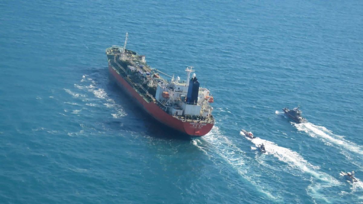 In this photo released Monday, Jan. 4, 2021, by Tasnim News Agency, a seized South Korean-flagged tanker is escorted by Iranian Revolutionary Guard boats on the Persian Gulf. Iranian state television acknowledged that Tehran seized the oil tanker in the Strait of Hormuz. The report on Monday alleged the MT Hankuk Chemi had been stopped by Iranian authorities over alleged “oil pollution” in the Persian Gulf and the strait.  (STR)
