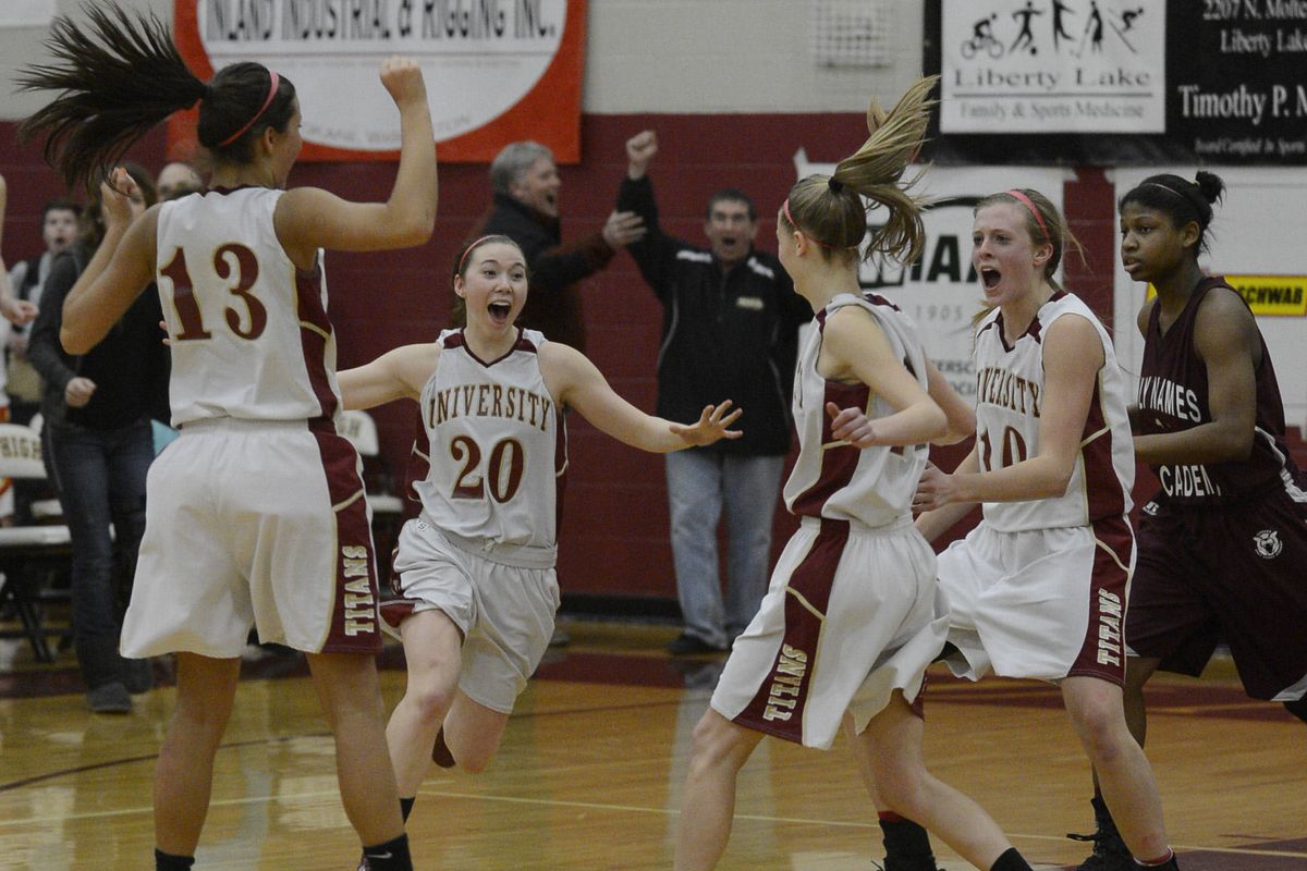 Titans Kaitlin Pannell (13), Mogan Hawley (20) and Kayleigh Valley (10) celebrate with McKenzie Peterson, whose basket sent game into OT. (Colin Mulvany)