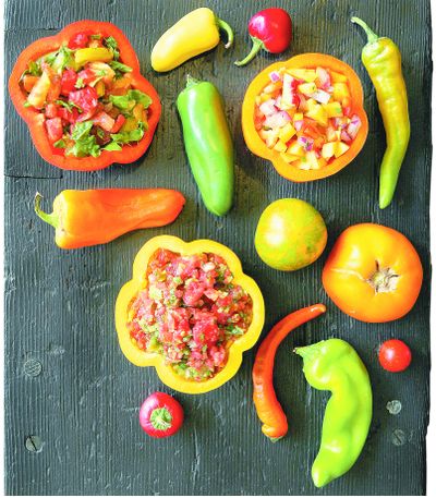 This detailed view of various salsa recipes includes, clockwise from top left, Pretty and Peppery Salsa, Spicy Fruit Salsa and Pico de Gallo.