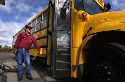 
Marlan Iverson fills up a Central Valley School District bus with biodiesel fuel at the Pacific Pride gas station on Appleway in the Spokane Valley. All Central Valley buses use biodiesel as part of a pilot program to cut toxic emissions. 
 (Liz Kishimoto / The Spokesman-Review)