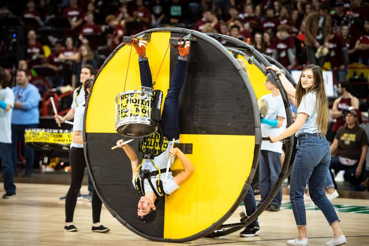 A Central Valley drummer is rolled onto the court during the during the Stinky Sneaker spirit competition against University at the Spokane Arena on Jan. 16, 2019. (Colin Mulvany)