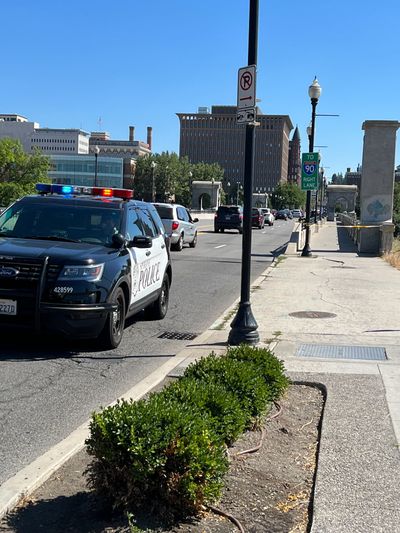 Police investigate a reported stabbing on the Monroe Street Bridge around 3 p.m. on Tuesday afternoon.  (Quinn Welsch/THE SPOKESMAN-REVIEW)