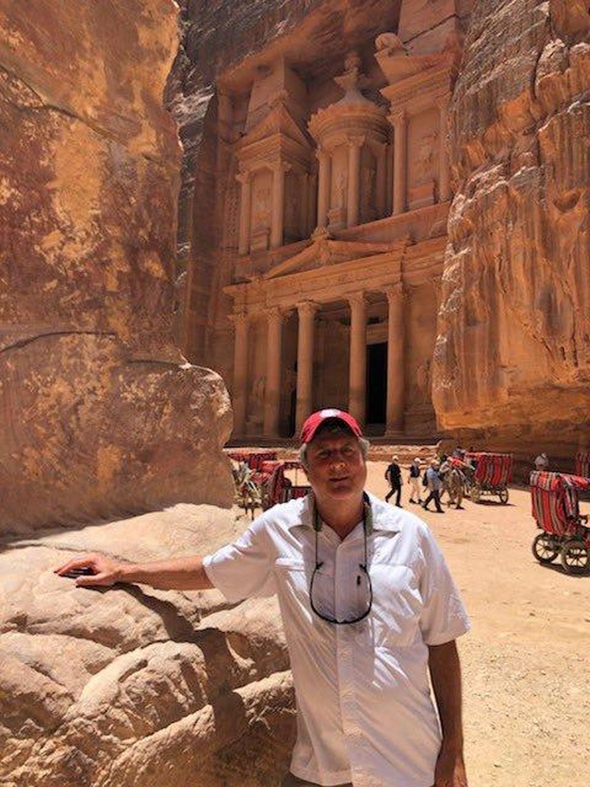 Washington State’s Mike Leach takes a photo in front of the Al-Khazneh temple in the historical archaeological site of Petra in Jordan. (Mike Leach/Twitter)