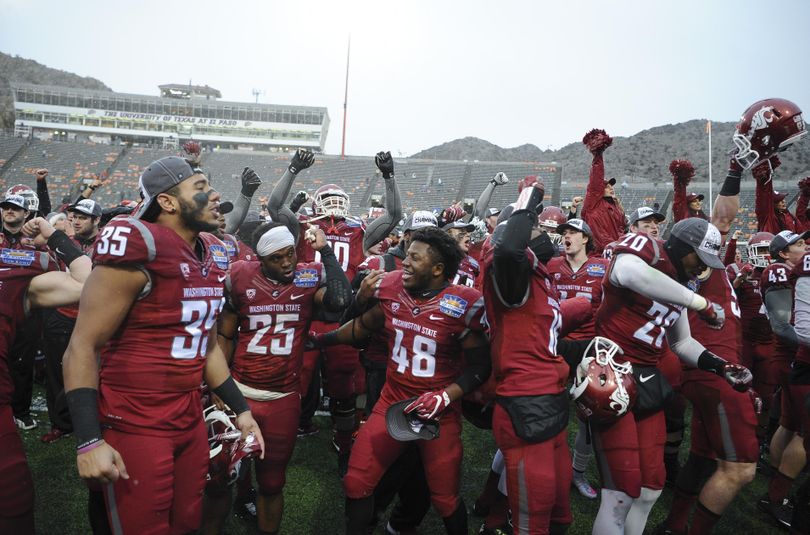 Washington State celebrates after defeating Miami during the second half of the 2015 Hyundai Sun Bowl on Saturday, Dec 26, 2015, at Sun Bowl Stadium in El Paso, TX. (Tyler Tjomsland / The Spokesman-Review)