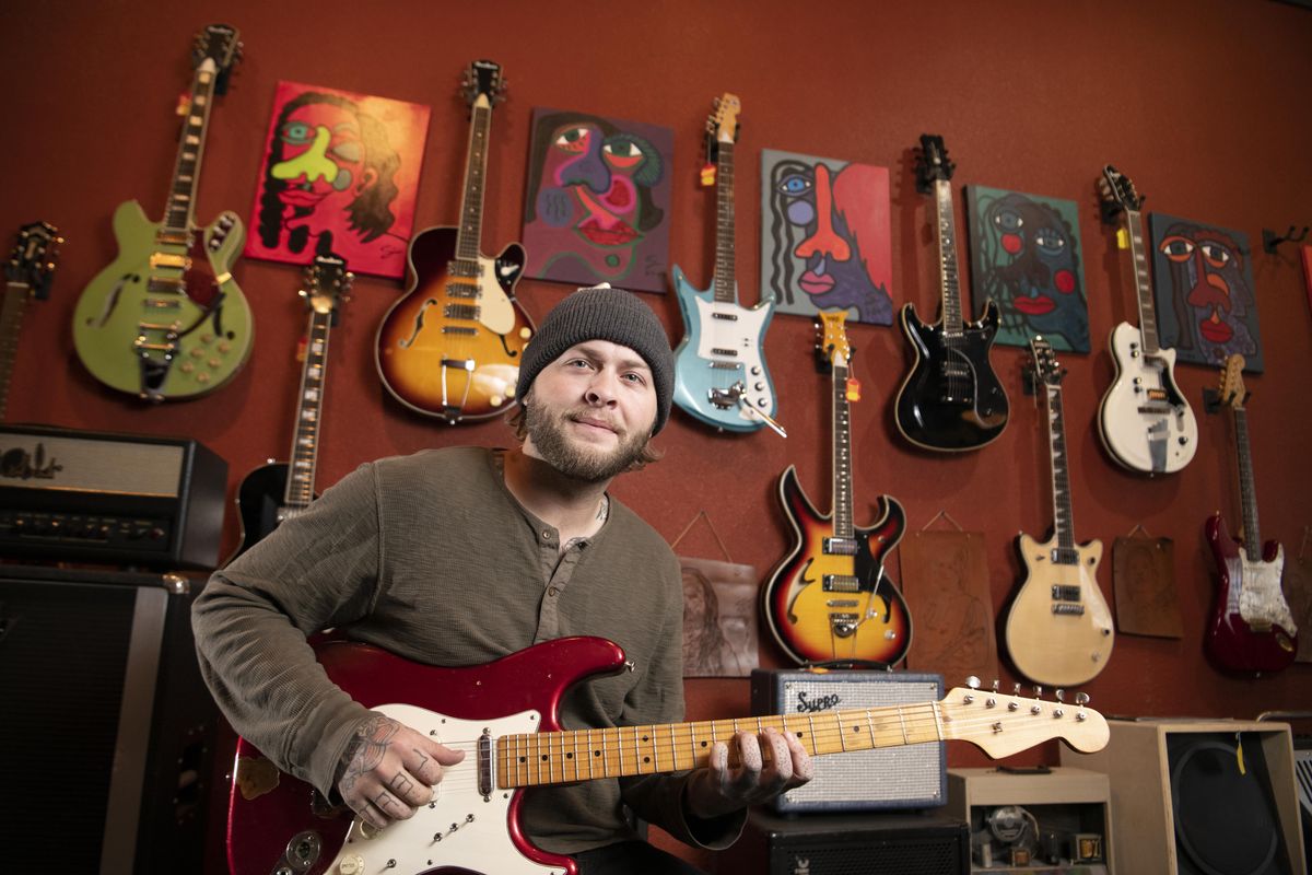 Proprietor Taylor Roff sits in his music store the Senator in Spokane on Feb. 4. Roff sells new and used guitars and equipment and makes repairs. (Jesse Tinsley / The Spokesman-Review)