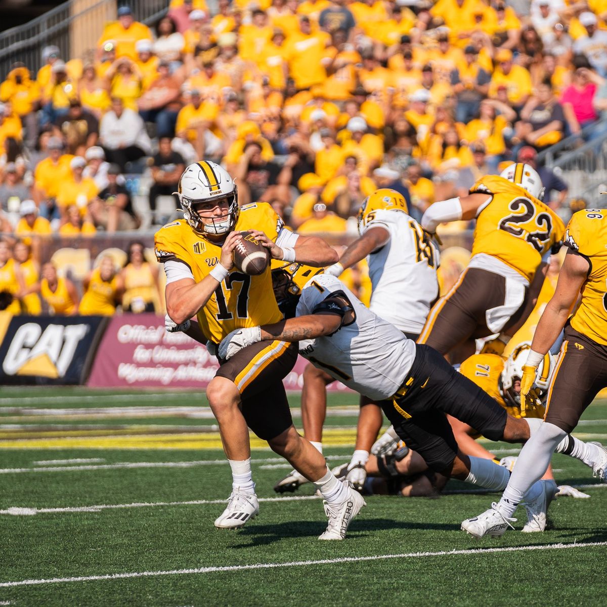 Idaho defensive lineman Keyshawn James-Newby wraps up Wyoming quarterback Evan Svoboda for one of his game-high three sacks Saturday in Laramie, Wy.  (Courtesy of Idaho Athletics)