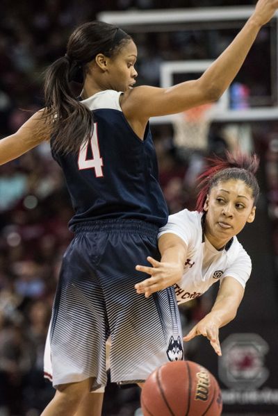 S.C.’s Bianca Cuevas passes around UConn’s Moriah Jefferson. (Sean Rayford / Associated Press)