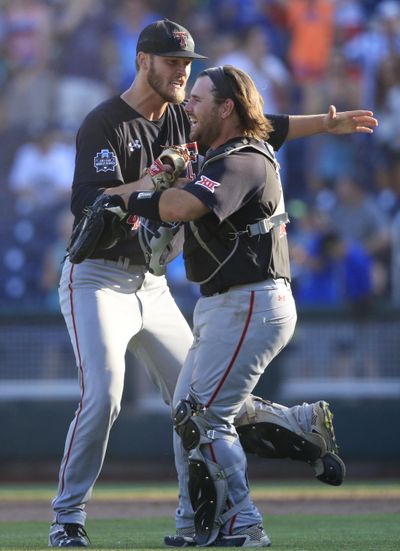 Texas Tech pitcher Hayden Howard, left, celebrates with catcher Tyler Floyd. (Nati Harnik / Associated Press)